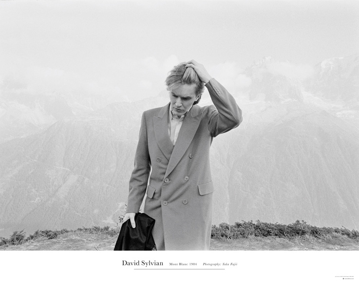 Mont Blanc (SamadhiSound # DSP01). Official poster by Samadhi (Samadhisound # DSP01 [Poster])  Limited edition poster of the iconic image of David Sylvian, taken by Yuka Fujii on Mont Blanc in 1984, as featured on the cover of the recently released 'A Victim of Stars' compilation. this is the first occasion on which Samadhisound have produced a poster of any kind and, in this instance, with the cooperation of the somewhat reticent photographer whose permission for use of her work in this capacity is rarely granted.  Measuring 24" x 36", and printed on 216 gsm quality paper, the poster, designed by Chris Bigg and strictly limited to just 500 units.